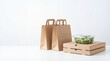 © Flowrender - Takeout food delivery with brown paper bags, stacked pizza boxes, and a fresh salad container on a pure white background with copy space.