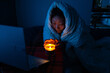 © Mykola - Woman suffers in no heating and no electricity during an energy crisis causing blackouts. power outage, blackout, load shedding or energy crisis, concept image.