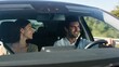 © Babb - Young caucasian couple enjoying road trip in car on sunny day