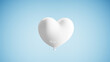 © Photocreo Bednarek - White heart balloon symbolizing love and romance floating on a soft blue background