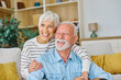 © Lumos sp - Happy active senior couple, portrait of an elderly woman with her husband sitting at home