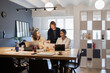 © ADDICTIVE STOCK - Diverse team collaborating on office project