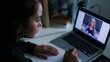 © Future Vision - Watching student taking notes at desk in home office, wearing dark top, laptop notebook, copy space