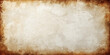 © hossain - Aged vintage parchment paper with a stained grunge texture and worn antique brown sepia tones creates a damaged retro blank page design for an ancient rough wallpaper background