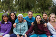 © Sabrina - Group of happy multiracial women circle smiling on camera outdoor - Female multi generational community, support and diversity concept