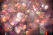 © Vjom - Pastel heart bokeh lights background with soft rainbow glow