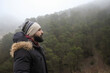 © Antonio Recena - A bearded man contemplates the landscape of trees and mist on a foggy winter day.
