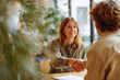 © EricMiguel - Smiling young woman shaking hands with interviewer in a bright office setting — successful job interview, agreement and professional connection