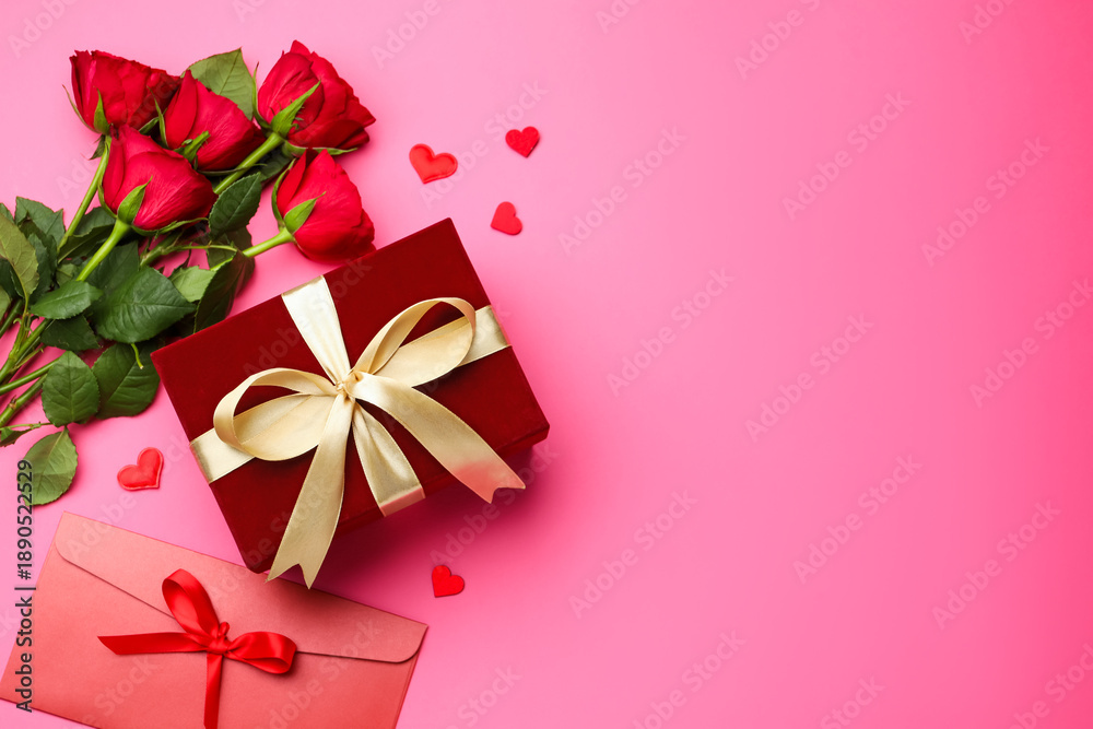 Beautiful velvet gift box, love letter, roses and decorative hearts on pink background, flat lay with space for text. Valentine's Day
