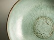 © Ytnart - A beautifully crafted ceramic bowl with a unique crackled glaze and intricate design, perfect for showcasing culinary creations.