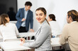 © JackF - Young smiling female student sitting in college class