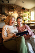 © Geber86 - Grandmother and granddaughter using tablet at home