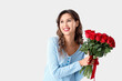 © Pixel-Shot - Happy young woman with bouquet of red rose flowers on white background