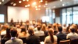 © Gianna - Unfocused Business Presentation Area - Gentle blur effect of a business presentation area with attendees. High quality