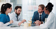 © SparkPix/peopleimages.com - Brainstorming, meeting and doctors with business person in planning for research grant or partnership. Healthcare, medical funding and support with team in hospital for investment collaboration deal