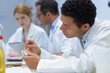 © auremar - group of scientists working at laboratory