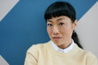 © VISTA by Westend61 - Portrait of an authentic woman in casual outfit looking at camera