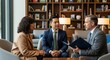 © Tanakorn - Diverse trio including a young Asian man and a middle-aged couple, consults a counselor in a modern business lounge, discussing important matters