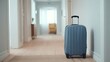 © Alex - A Sleek, Modern Travel Suitcase Positioned in a Quiet Hallway, Ready for Adventure and Exploration Amidst a Minimalist Interior Design