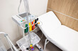 © Paweł Michałowski - Hospital medical equipment beside patient bed. Modern monitoring device and infusion stand. Clean clinic interior. Healthcare technology in treatment room. Professional medical care environment.