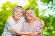 © BillionPhotos.com - Happy senior love couple relax in the park.