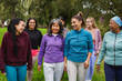 © Sabrina - Group of multiracial women with different age and body walking together at city park - Multi generational people, sport training and female community concept