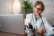 © Nenad - Medicine doctor's writing on laptop in medical office