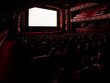© Victor - Full theatre audience watching projection screen from behind, historic Art Deco cinema interior with balconies