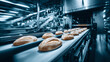 © Kanomaoi - Rows Of Freshly Baked Golden Buns Cooling On A Factory Metal Conveyor