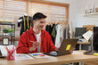 © crizzystudio - Young asian man fashion designer working on laptop