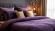 © Igor - Premium bed with a deep purple quilt and soft, luxurious pillows .