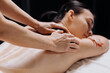 © wedmoments.stock - Female client receiving a relaxing massage from a therapist at a wellness center, with soft lighting and a tranquil atmosphere enhancing the spa experience
