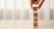 © ABDOU BERRI - Business Strategy Execution and Goal Achievement. Hand stacking target block above completed tasks, representing priority focus vertical growth and achievement driven decision making.