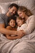 © Juan - Happy family sleeping together in bed with peaceful expressions during early morning light