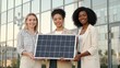 © feng - Three women holding solar panel