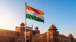©  Elvira Astahova - Indian flag waving in front of historic Red Fort at sunrise