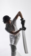 © Lustre Art Group  - Cricket batter preparing defensive shot in studio setting. Concept of sports training, athlete concentration, technical batting practice, and controlled game situations for coaching and education.