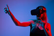 © Volodymyr_sh - Female Gamer Using Virtual Reality Headset With Gesture Control, Futuristic Gaming Technology and Immersive Digital World
