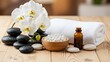 © budhe - A serene spa setup with orchids and stones on a wooden table