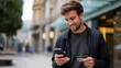 © Kateryna - Young man using smartphone and holding credit card on city street urban payment or shopping scenario outdoors mobile transaction in metropolitan environment casual digital