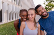 © PintoArt - Diverse group of young friends smiling happily outdoors