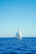 © ADDICTIVE STOCK - Sailboat under clear blue sky on calm sea