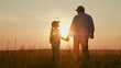 © Victoriia - Family picnic in park. Dad walks with little daughter on grass, sunset. Happy family travels plays in sun park. Childhood dream travel. Dad, kid daughter relaxing in nature. Father raising child girl