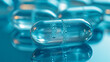 © Natalia - High-angle close-up of transparent collagen capsules and peptides supplements on a blue background. Concept of clean beauty, skin rejuvenation, and healthy dietary habits