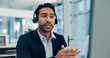 © SparkPix/peopleimages.com - Businessman, agent and customer service with headset in office for virtual assistance. Man, consultant or listening with mic on computer for CRM help, online advice or telemarketing in workplace