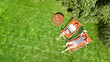 © Iuliia Sokolovska - Young girls relax in summer garden in sunbed deckchairs on grass, women friends have fun outdoors in green park on weekend, aerial drone view from above