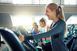 © BuyoutReese07/peopleimages.com - Treadmill, smile and woman in gym for cardio workout, wellness and endurance for health benefits. People, machine and happy athlete in facility for exercise, fitness and routine for intense training