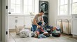 © Alex - Man sorting laundry in laundry room with colorful clothes and baskets