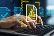 © tadamichi - Problematic document and reject file. Error notification on approval system. Businessman using laptop computer to submit documents to compliance verification system.