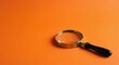 © tamimdesignhub - Magnifying Glass on Orange Background Close Up Detail Zoom Lens Optical Tool for Investigation and Discovery Exploration Research Science